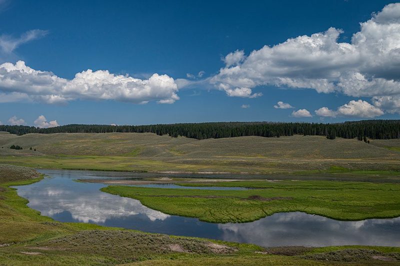 USA, Wyoming. Clouds reflected in Yellowstone River, Hayden Valley, Yellowstone National Park. art print by Howie Garber for $57.95 CAD