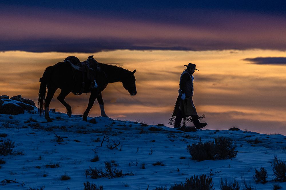 USA- Wyoming. Hideout Horse Ranch- wrangler and horse at sunset. art print by Hollice Looney for $57.95 CAD