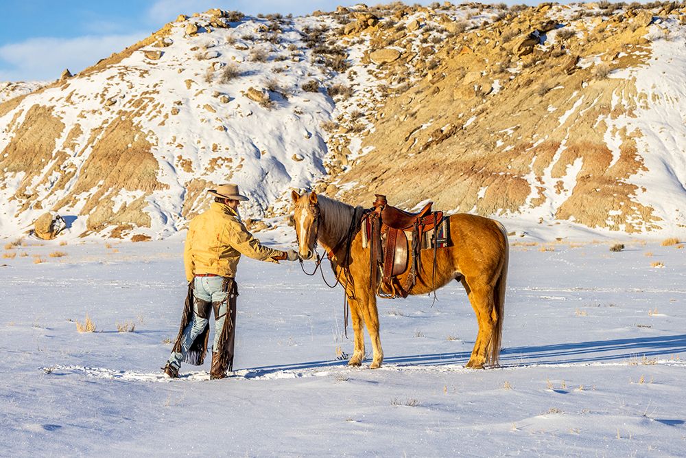 USA- Wyoming. Hideout Horse Ranch- wrangler and horse in snow. art print by Hollice Looney for $57.95 CAD