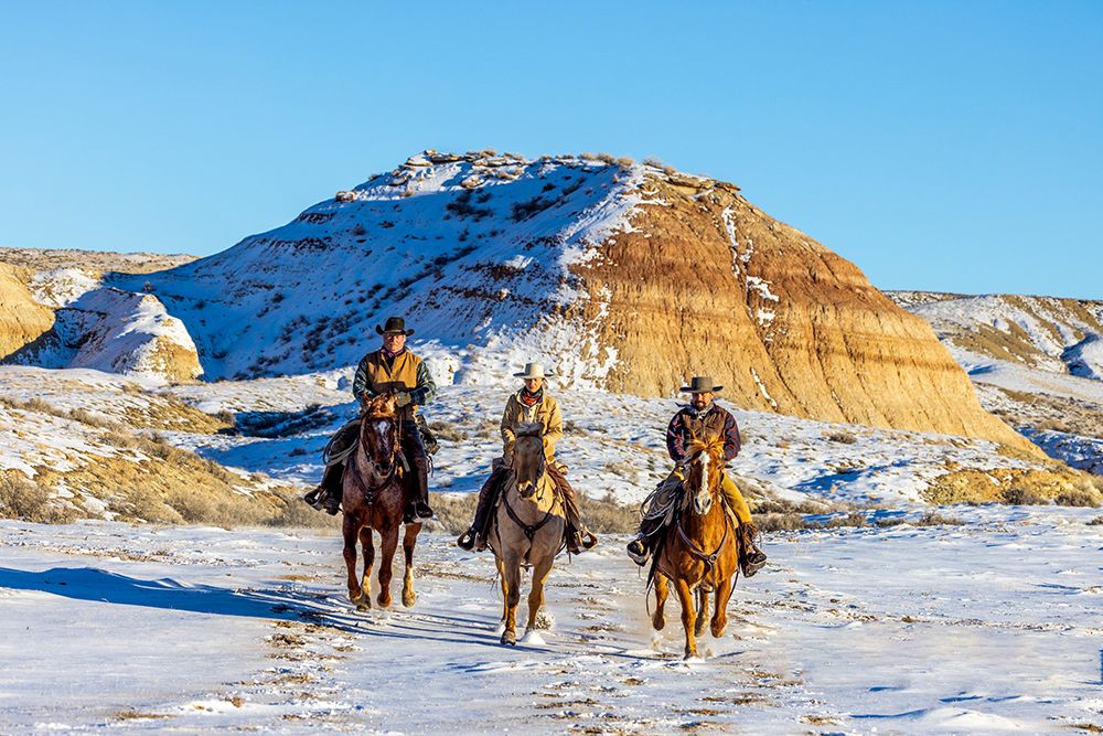 USA- Wyoming. Hideout Horse Ranch- wranglers and horses in snow. art print by Hollice Looney for $57.95 CAD