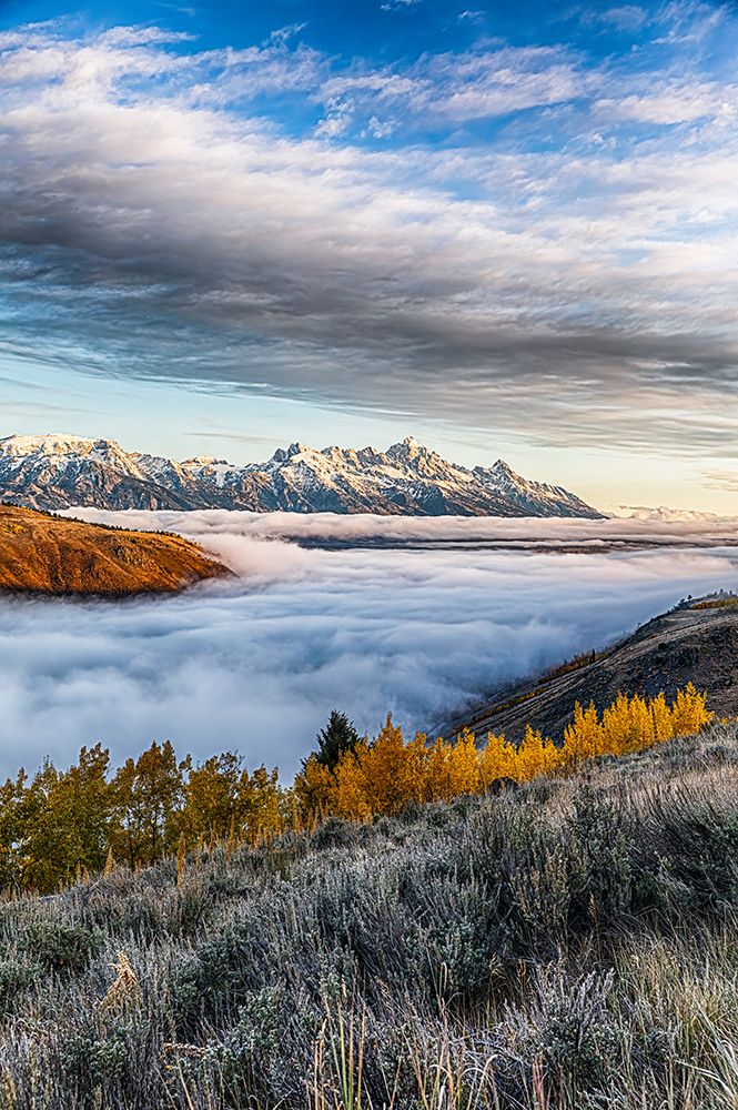 Layer of fog in the valley below the peaks of Grand Teton National Park. art print by Larry Richardson for $57.95 CAD