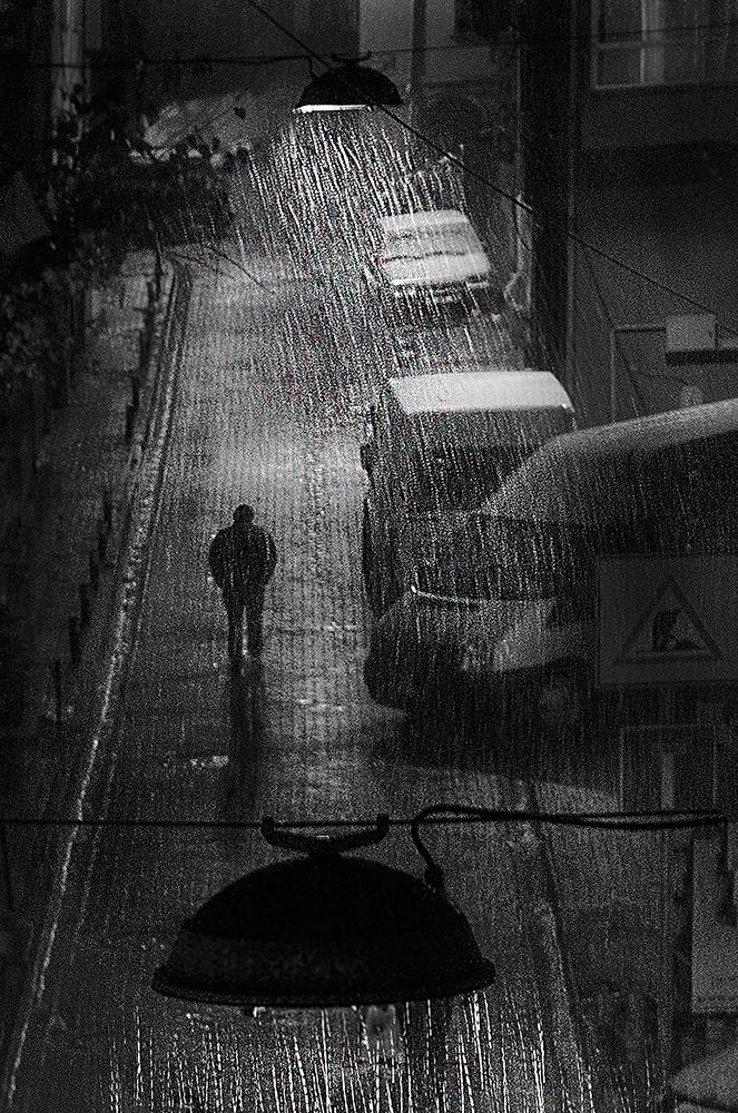Rainy man art print by Nihal Eken for $57.95 CAD