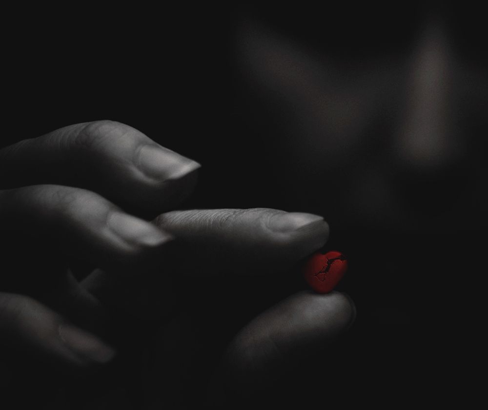 Broken red heart in the moody girls hands. art print by Aleksandr Sumarokov for $57.95 CAD