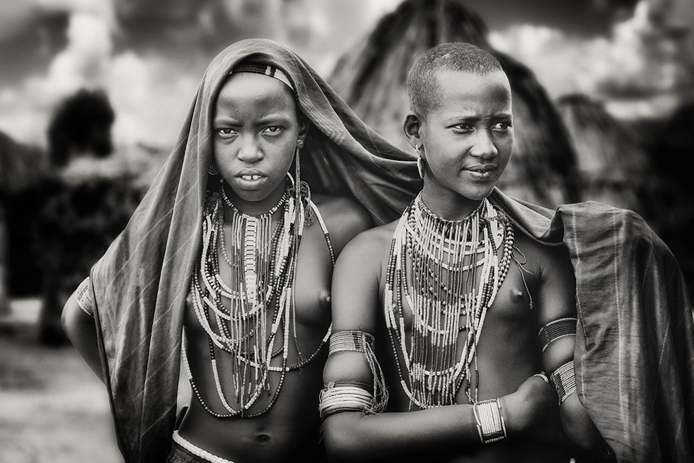 Karo girls sharing a scarf art print by Piet Flour for $57.95 CAD