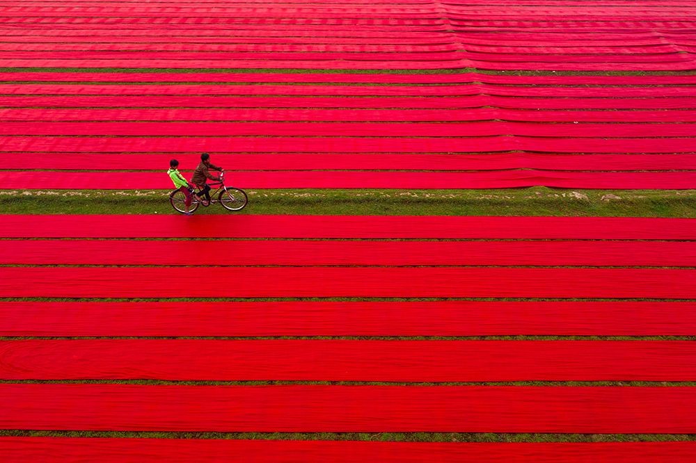 Bicycle on red cloths art print by Azim Khan Ronnie for $57.95 CAD