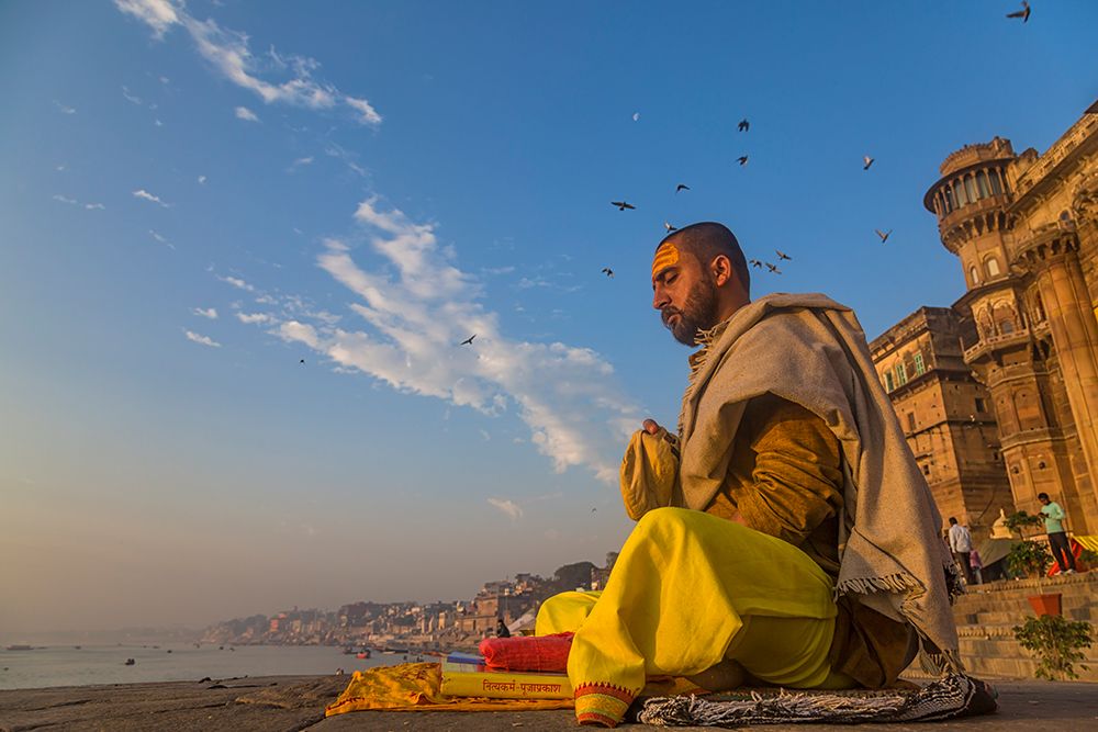 Morning meditation along Ganges art print by Souvik Banerjee for $57.95 CAD