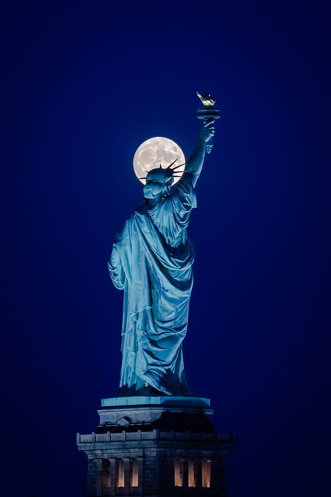 Moonrise behind Liberty art print by Peter Beckwermert for $57.95 CAD
