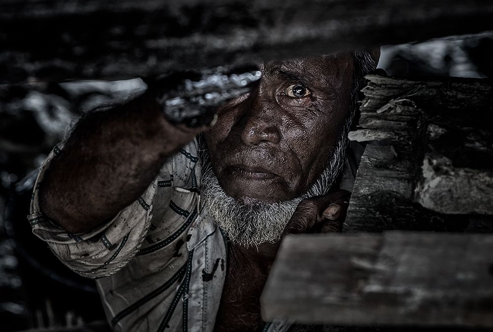 Man Tarring The Keel Of A Ship - Bangladesh art print by Joxe Inazio Kuesta for $57.95 CAD
