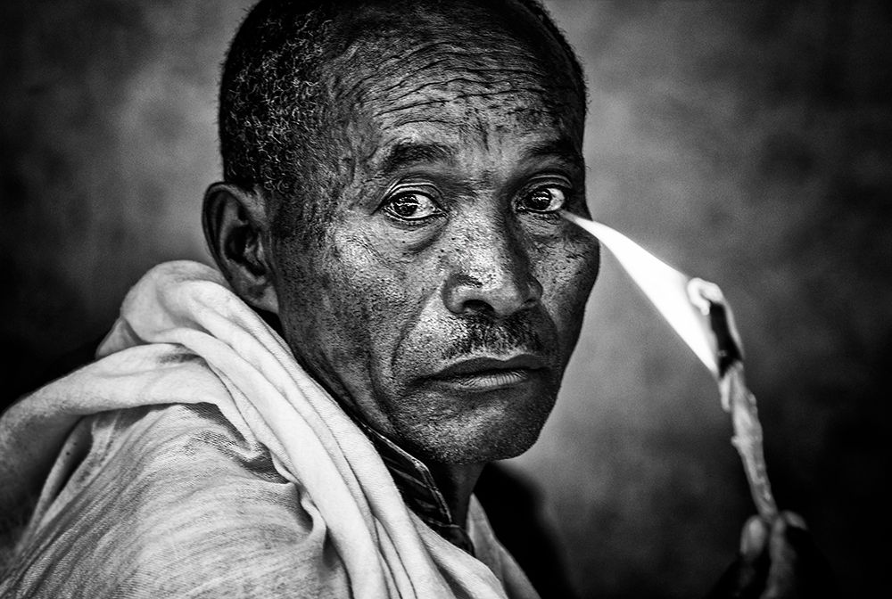 Ethiopian Man Holding A Lit Candle In A Religious Ceremony. art print by Joxe Inazio Kuesta for $57.95 CAD