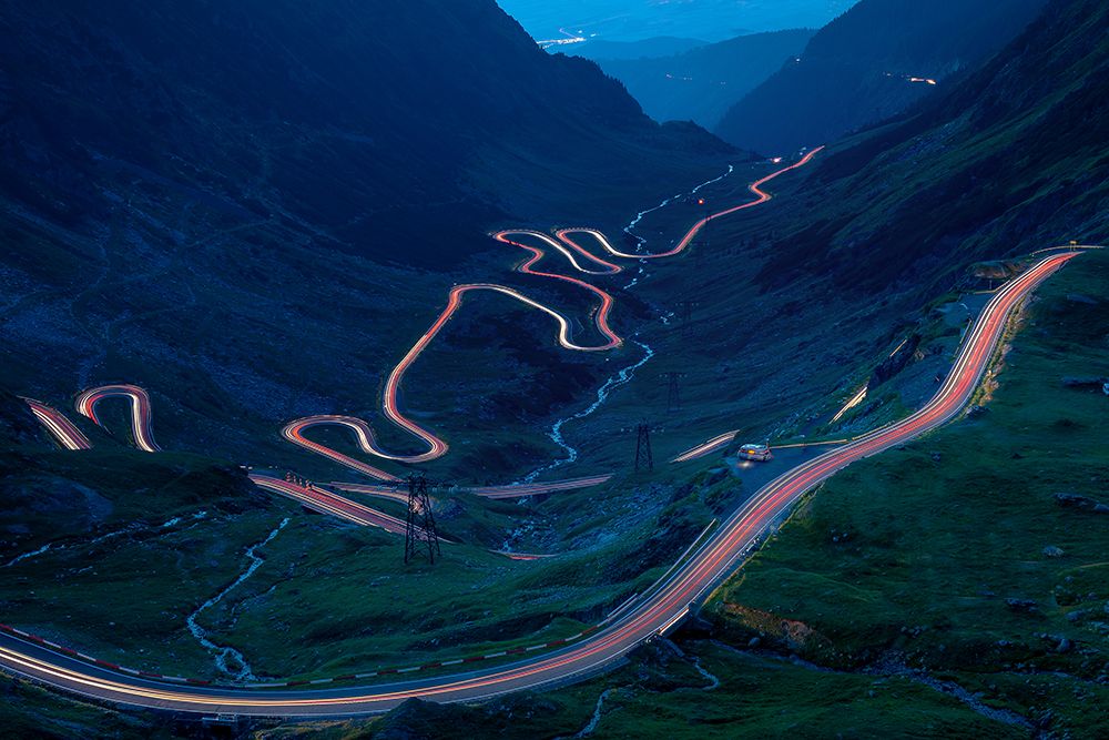 Light Trails On The Highest Mountain Road In Romania-Fagaras Mountains art print by Vio Oprea for $57.95 CAD