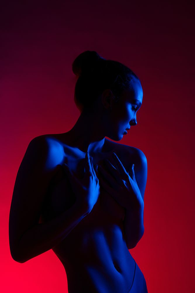 Young Woman In Casual Clothes Standing Under Neon Light art print by Andrey Guryanov for $57.95 CAD