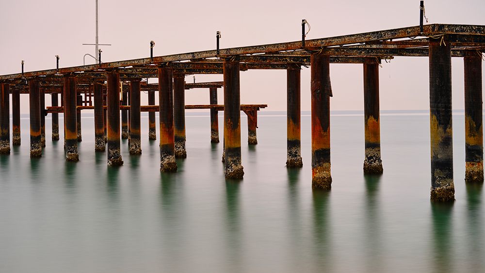 Old Pier On The Beach And Long Exposure Sea Waves art print by Engin Akyurt for $57.95 CAD