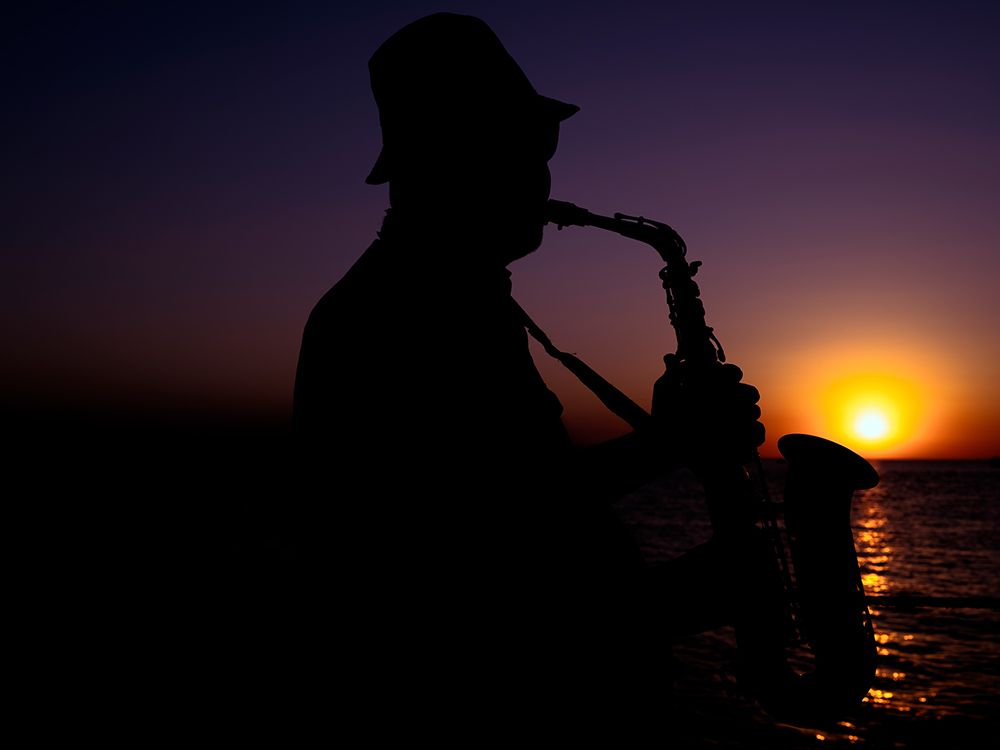 A Musician Playing The Saxophone At Sunset art print by Engin Akyurt for $57.95 CAD