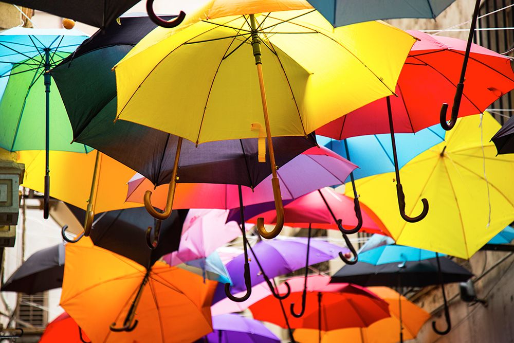Old Building And Decorative Umbrellas art print by Engin Akyurt for $57.95 CAD