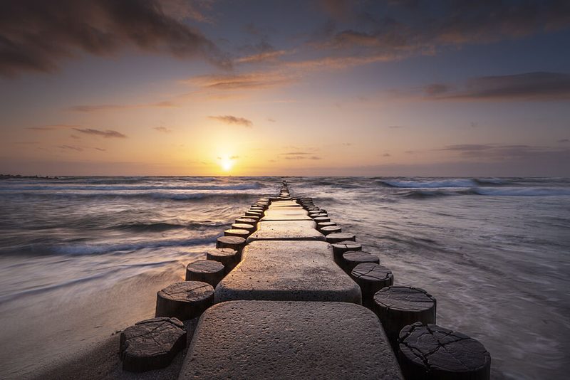 Golden Hour Ocean Groyne art print by Fotomarion for $57.95 CAD