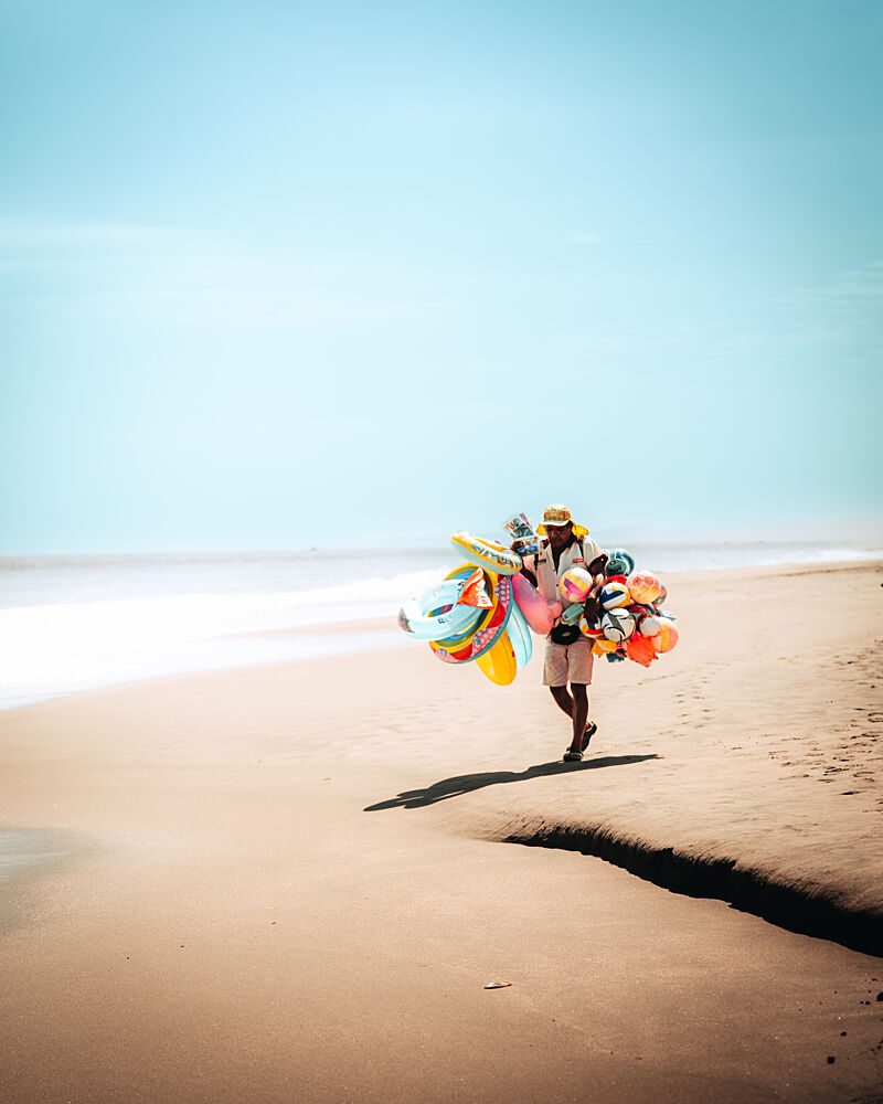 Colorful Beach Vendor art print by Monica Galvez for $57.95 CAD