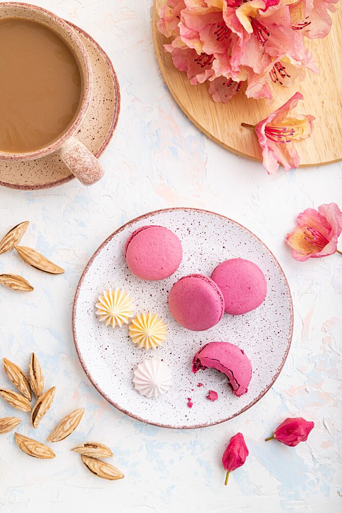 Pink Macarons and Coffee art print by Uladzimir for $57.95 CAD