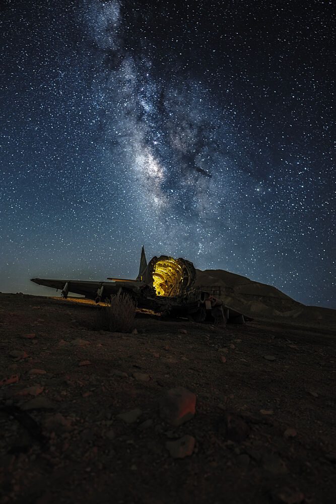 Glowing Plane Night Sky art print by Doron Braunstein for $57.95 CAD