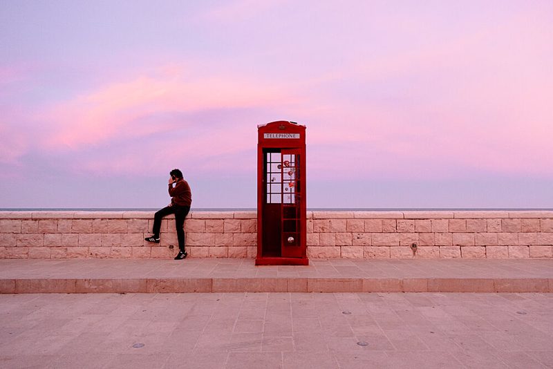 Red Phone Booth Pink Sky art print by Vito Muolo for $57.95 CAD