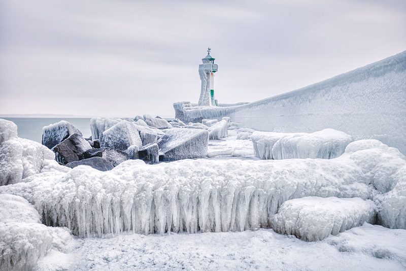 Icy Coastal Lighthouse art print by Dieter Weck for $57.95 CAD