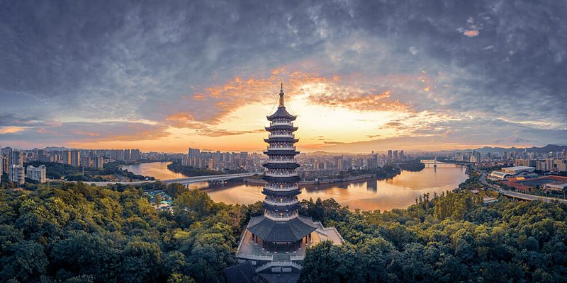Riverside Pagoda Sunset art print by Qiye for $57.95 CAD
