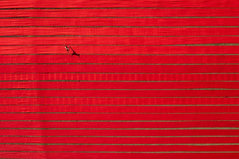 Red Field Lone Figure art print by Azim Khan Ronnie for $57.95 CAD