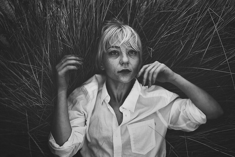 Pensive Woman in Grass art print by Yuri Shepelev for $57.95 CAD
