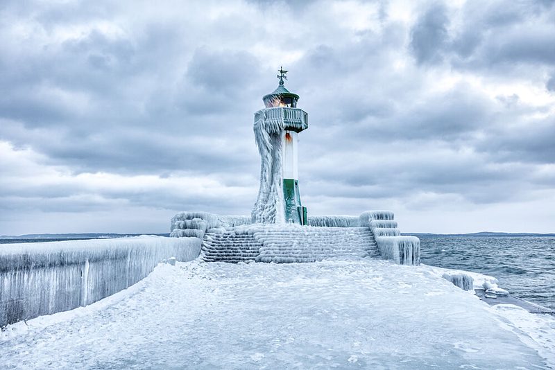 Frozen Winter Lighthouse art print by Dieter Weck for $57.95 CAD