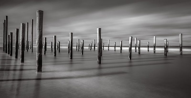 Calm Ocean Pilings art print by Hans van Zuijlen for $57.95 CAD