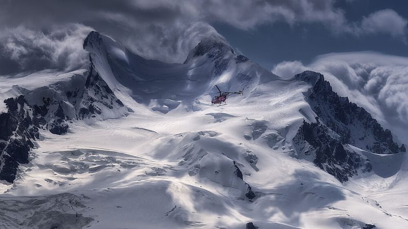 Red Helicopter Alpine Peaks art print by Oskar Baglietto for $57.95 CAD