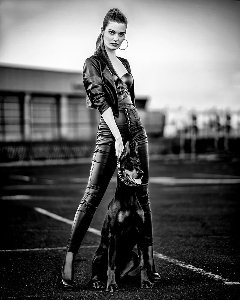 Powerful Woman and Doberman art print by Vasil Nanev for $57.95 CAD