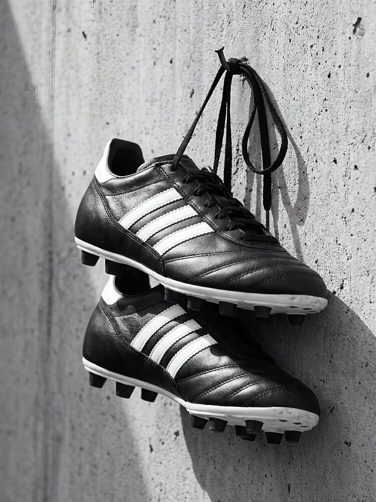 Hanging Soccer Cleats art print by Andreas Magnusson for $57.95 CAD