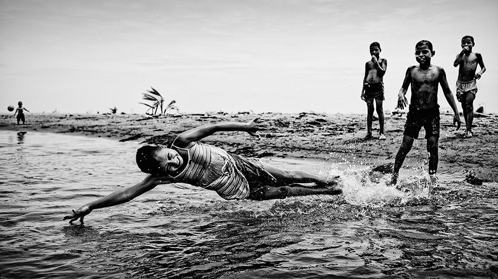 Children in the water art print by Paul Gomez for $57.95 CAD