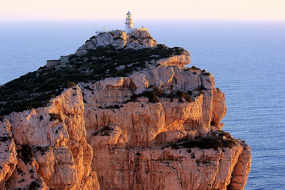 Peaceful Lighthouse on the cliff at sunset art print by Saiu Giovanni for $57.95 CAD