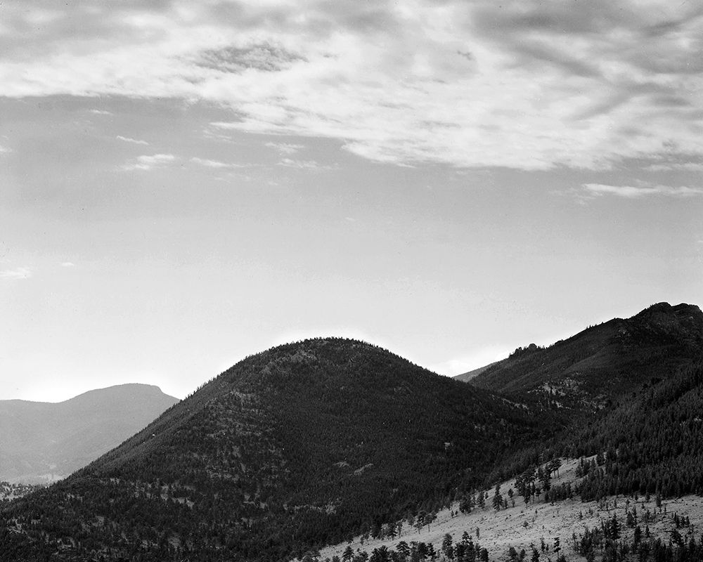 View of hill with trees, clouded sky, in Rocky Mountain National Park, Colorado, ca. 1941-1942 art print by Ansel Adams for $57.95 CAD