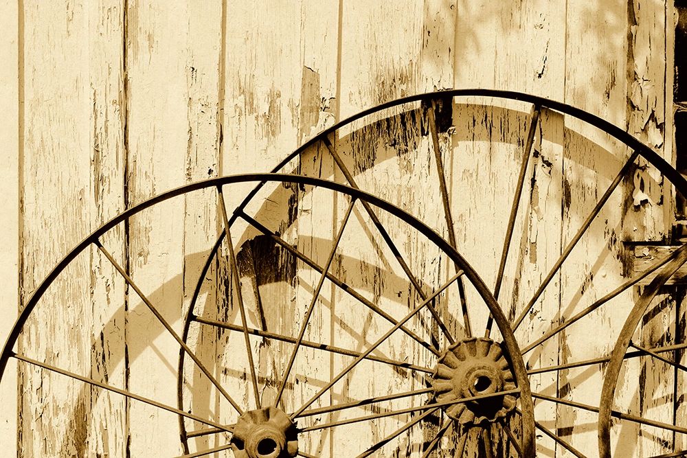 Old wagon wheels against a shed in Buffalo Gap Historic Village, near Abilene, TX - Sepia art print by Carol Highmith for $57.95 CAD