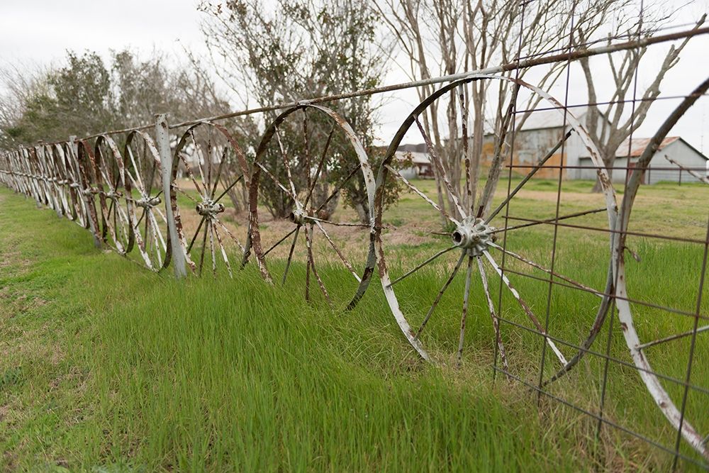 A fence made of wagon wheels near Schulenburg in Fayette County, TX art print by Carol Highmith for $57.95 CAD