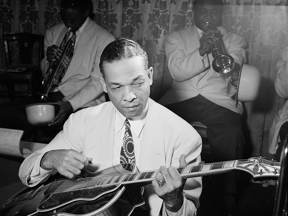 Fred Guy playing guitar at the Aquarium-New York 1946 art print by William Gottlieb for $57.95 CAD