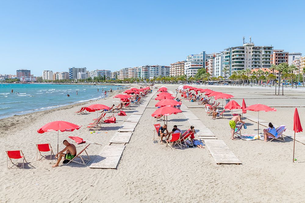 Albanian Beach with Red Umbrellas art print by Richard Silver for $57.95 CAD