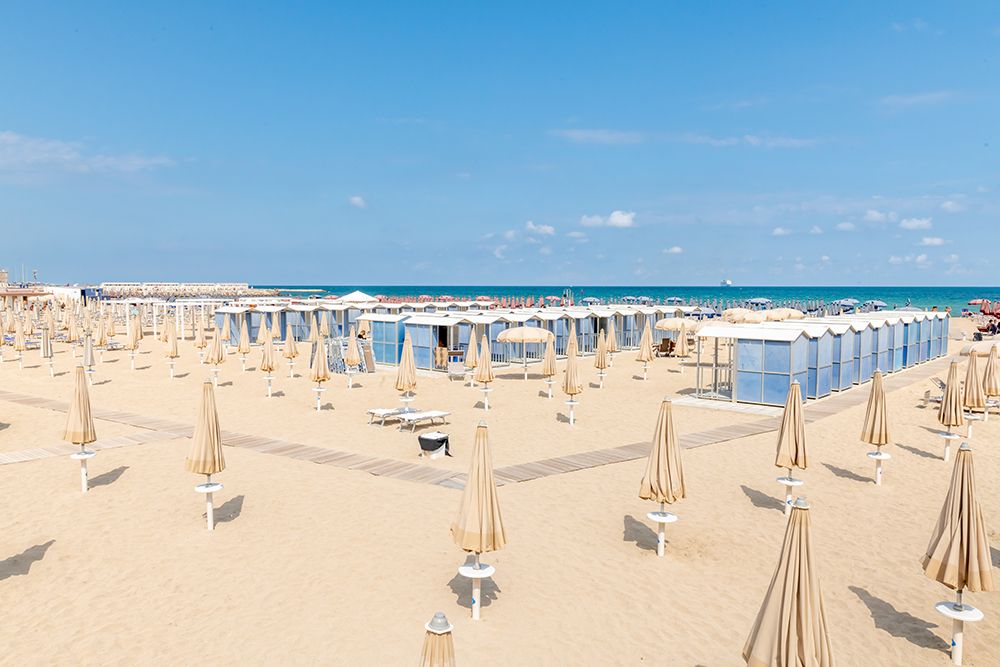 Cream Umbrella Beach Resort art print by Richard Silver for $57.95 CAD