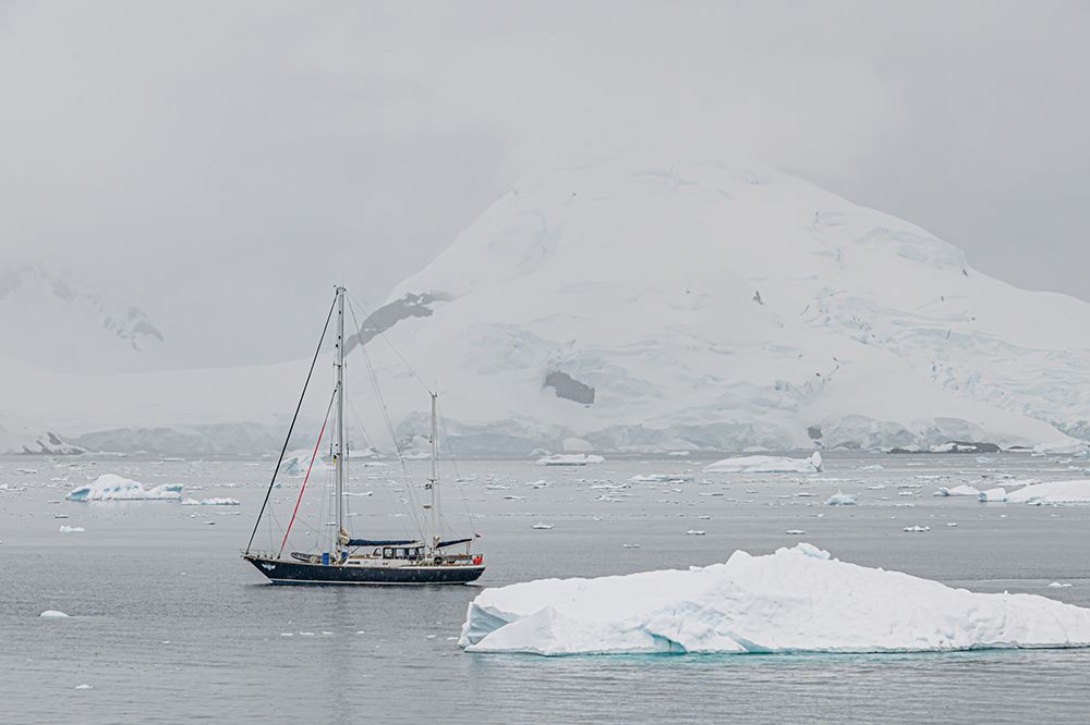 Sailboat Below Antarctic Mountain art print by Richard Silver for $57.95 CAD