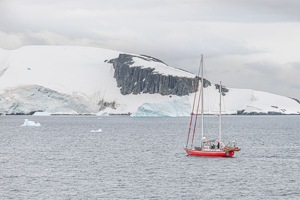 Red Sailboat Near Dark Rock Outcrop art print by Richard Silver for $57.95 CAD