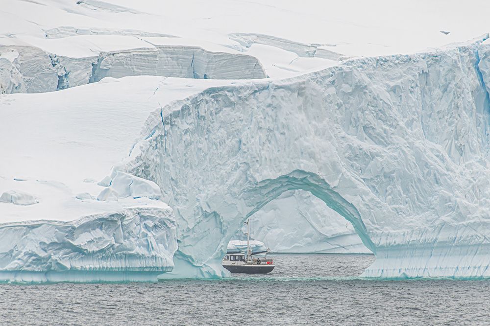 Expedition Boat Through Iceberg Arch art print by Richard Silver for $57.95 CAD