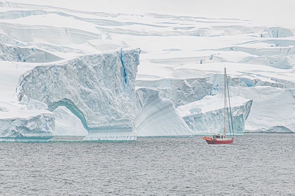 Red Sailboat Eroded Iceberg Formation art print by Richard Silver for $57.95 CAD