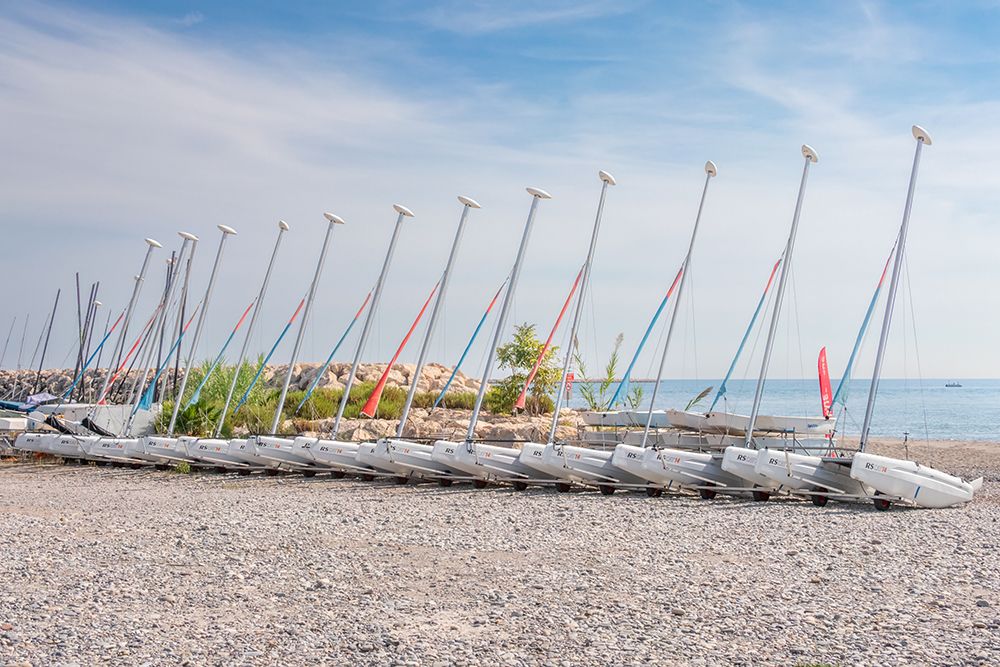 French Riviera Sailboats on Pebble Beach art print by Richard Silver for $57.95 CAD