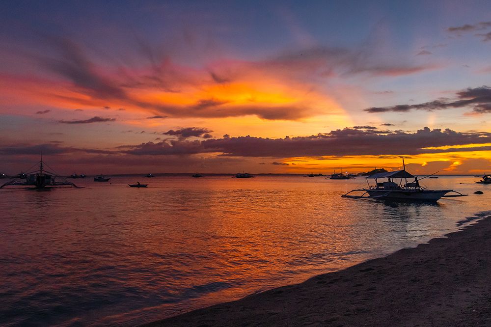 Dramatic Sunset Over Bangka Boats, Philippines art print by Richard Silver for $57.95 CAD
