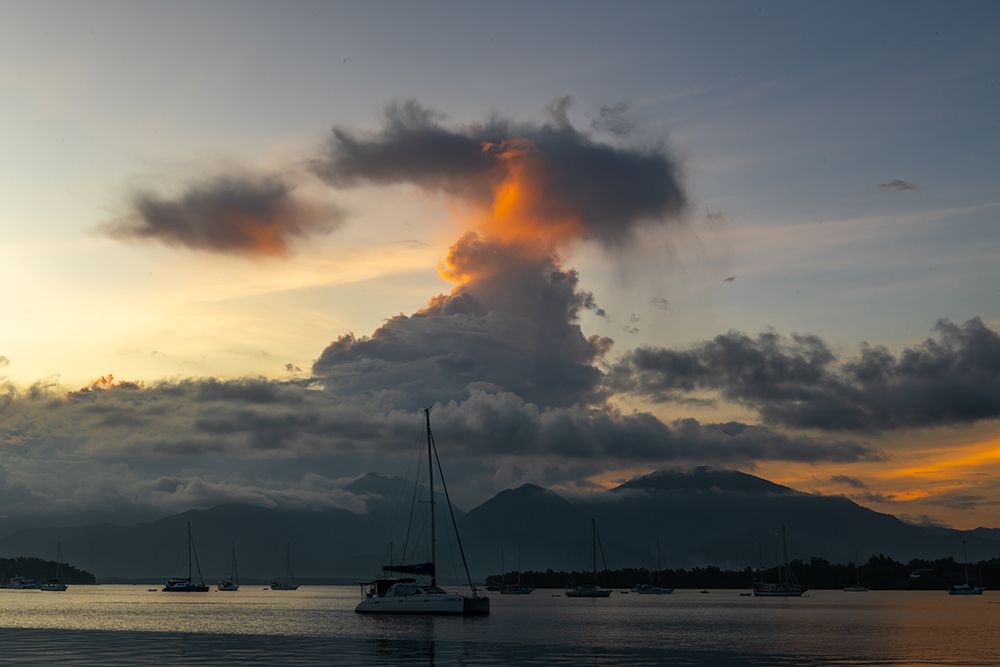 Sailboat at Dusk with Mountain Silhouette, Philippines art print by Richard Silver for $57.95 CAD