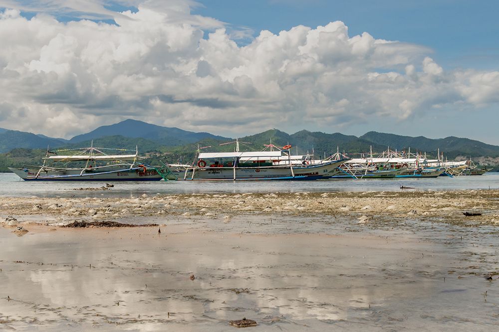Fishing Boats at Low Tide with Mountains, Philippines art print by Richard Silver for $57.95 CAD