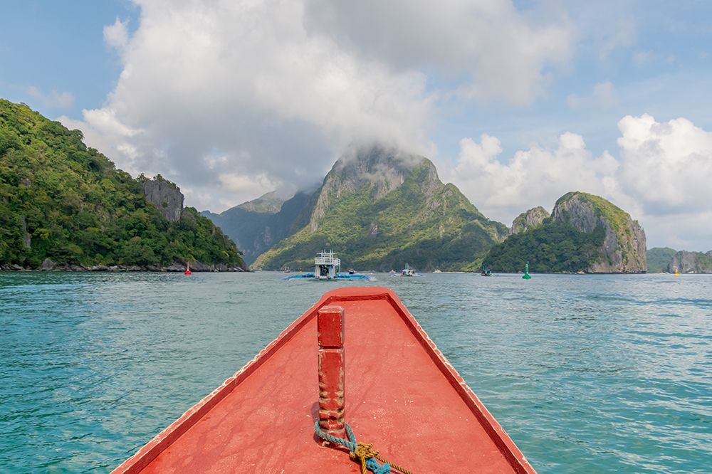 Boats Bow Approaching Limestone Islands, El Nido, Palawan, Philippines art print by Richard Silver for $57.95 CAD