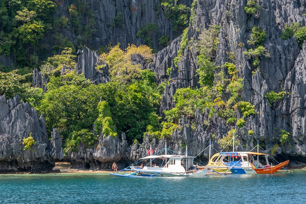 Boats Anchored Near Limestone Cliffs, El Nido, Palawan, Philippines art print by Richard Silver for $57.95 CAD